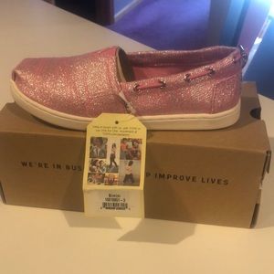 Brand new, Tom’s pink glittery slip on shoe